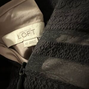 Loft size 12 black dress. Never worn.  Took the tags off. excellent condition.